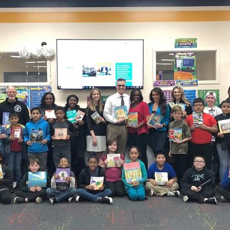 Delaware literacy organization Success Won't Wait donates alomost 500 books to Eisenberg Elementary. Vincenza Carrieri-Russo